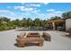 Expansive backyard featuring a pool, fire pit, and outdoor kitchen, perfect for entertaining and relaxation at 14227 County Road 455, Clermont, FL 34711