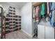 Spacious walk-in closet with clothing racks, shoe storage, and overhead storage at 14227 County Road 455, Clermont, FL 34711