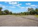Wide circular driveway leads to a sprawling home and landscaped grounds at 14227 County Road 455, Clermont, FL 34711