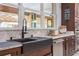Stylish kitchen sink featuring granite countertops, updated appliances, and bright natural light at 14227 County Road 455, Clermont, FL 34711