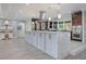 Stunning kitchen with a large island, stainless steel appliances, and ample counter space at 14227 County Road 455, Clermont, FL 34711