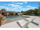 Resort-style pool with waterfalls and sun loungers in a beautifully landscaped backyard at 14227 County Road 455, Clermont, FL 34711