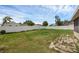 Spacious, well-maintained backyard enclosed by a white fence, perfect for outdoor activities at 1491 Providence Blvd, Deltona, FL 32725