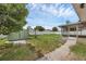 The backyard features a shed, screen porch and white vinyl fence at 1491 Providence Blvd, Deltona, FL 32725
