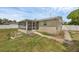 Backyard view of home with a screened in porch and a patio area at 1491 Providence Blvd, Deltona, FL 32725