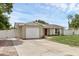 Charming single-story home with an attached one-car garage and fenced in yard at 1491 Providence Blvd, Deltona, FL 32725