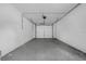 Spacious, clean garage offering ample storage and parking, featuring a modern overhead door system at 1491 Providence Blvd, Deltona, FL 32725