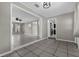 Open-concept living space featuring tiled floors and neutral wall paint at 1491 Providence Blvd, Deltona, FL 32725