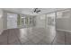 Spacious living room with tile floors, ceiling fan and natural light at 1491 Providence Blvd, Deltona, FL 32725