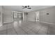 Spacious living room with tile floors, ceiling fan and natural light at 1491 Providence Blvd, Deltona, FL 32725
