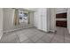 Open living area featuring tiled floors, storage, and natural light at 1491 Providence Blvd, Deltona, FL 32725