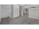 Open living space featuring tiled floors, storage, and access to other rooms at 1491 Providence Blvd, Deltona, FL 32725