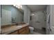 Bathroom featuring a granite countertop, glass shower, and tile flooring at 1496 Lime Grove Ln, The Villages, FL 32162