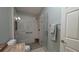 Bathroom featuring a glass enclosed shower with a built in seat and hand rails at 1496 Lime Grove Ln, The Villages, FL 32162
