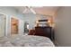 Bedroom with ceiling fan and a view to the ensuite bathroom, closet and sitting room at 1496 Lime Grove Ln, The Villages, FL 32162