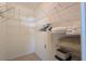 Walk-in closet with wire shelving, providing ample storage space for clothing and accessories at 1496 Lime Grove Ln, The Villages, FL 32162