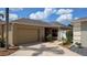 Single story home with a one car garage and a well maintained yard at 1496 Lime Grove Ln, The Villages, FL 32162