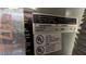 Image features the HVAC model and serial number sticker for the central AC unit at 1496 Lime Grove Ln, The Villages, FL 32162