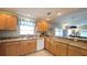 Granite countertops and stainless steel appliances highlight this open concept kitchen at 1496 Lime Grove Ln, The Villages, FL 32162