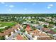 Aerial view of a beautiful home close to a tennis court and golf course located in a quiet neighborhood at 1509 Trenton Ln, The Villages, FL 32162