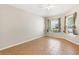 Bright bedroom featuring tile flooring, neutral paint, and dual window views at 1509 Trenton Ln, The Villages, FL 32162