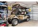 Garage includes golf cart and storage providing functionality and convenience at 1509 Trenton Ln, The Villages, FL 32162