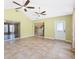 Sunroom with tiled floor, lots of windows and sliding door to outside at 1509 Trenton Ln, The Villages, FL 32162