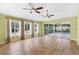 Bright sunroom with tiled flooring, ceiling fans, and large windows at 1509 Trenton Ln, The Villages, FL 32162