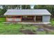 An aerial view of the barn, with a metal roof, that is ready for your animals at 15104 County Road 48, Astatula, FL 34705