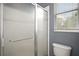 Shower with glass door and tiled walls in the bathroom at 15104 County Road 48, Astatula, FL 34705