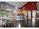 Open kitchen with stainless steel appliances, granite countertops, and ample cabinet space at 15104 County Road 48, Astatula, FL 34705