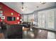 Stylish living area with dark wood floors, French doors, and ample natural light at 15104 County Road 48, Astatula, FL 34705