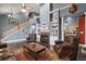 Large living room showcasing a fireplace, high ceilings, and an open layout at 15104 County Road 48, Astatula, FL 34705