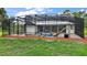 A view of the pool and backyard of this property with plenty of space for activities at 15104 County Road 48, Astatula, FL 34705