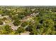 Residential lot surrounded by mature trees, with other houses in the distance at 15925 Summit Ct, Clermont, FL 34711