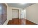 Bedroom featuring wooden floors, a closet with wire shelves, and a white door at 15925 Summit Ct, Clermont, FL 34711