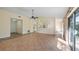 Open living room featuring a ceiling fan, tiled floors, and access to the balcony at 15925 Summit Ct, Clermont, FL 34711