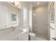 Bright bathroom with a glass-enclosed shower, elegant vanity, and contemporary fixtures for a luxurious feel at 16030 Vetta Dr, Bella Collina, FL 34756