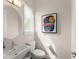 Stylish powder room featuring a modern round mirror, vessel sink, and natural light from the window blinds at 16030 Vetta Dr, Bella Collina, FL 34756