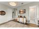 Charming bedroom featuring a stylish dresser, modern decor, and an adjacent bathroom for added convenience at 16030 Vetta Dr, Bella Collina, FL 34756