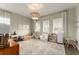 Bright and airy bedroom with decorative wallpaper and ample natural light at 16030 Vetta Dr, Bella Collina, FL 34756