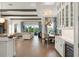 Open-concept living area with a dining area and a view of the outdoor space at 16030 Vetta Dr, Bella Collina, FL 34756