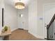 Welcoming entryway with wood floors, modern lighting, and a smart home control panel at 16030 Vetta Dr, Bella Collina, FL 34756