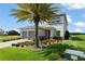 Two-story home with a two-car garage, landscaped front yard and a mature palm tree at 16030 Vetta Dr, Bella Collina, FL 34756