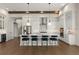 Spacious kitchen boasts a large island with pendant lighting, seating, and modern appliances at 16030 Vetta Dr, Bella Collina, FL 34756