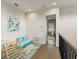 Upstairs play area with soft rug, fun furniture, and natural light at 16030 Vetta Dr, Bella Collina, FL 34756