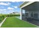 Backyard showcasing a private pool, manicured lawn and screened patio, perfect for outdoor entertaining at 16030 Vetta Dr, Bella Collina, FL 34756