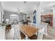 Bright dining area with table and view to the living room, flooded with natural light at 16863 Se 110Th Court Rd, Summerfield, FL 34491