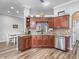 Spacious kitchen featuring ample cabinetry, countertops, and stainless steel appliances at 16863 Se 110Th Court Rd, Summerfield, FL 34491