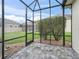 Spacious screened lanai with stone flooring, providing an inviting outdoor living area at 16863 Se 110Th Court Rd, Summerfield, FL 34491